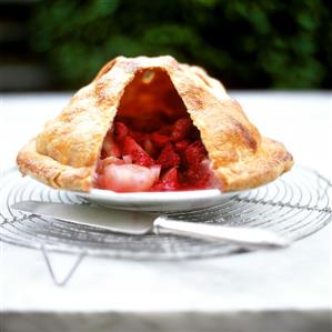 Fruit pie with a piece of crust removed