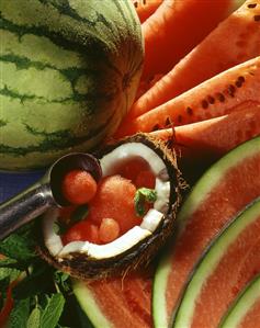 Watermelons and half a coconut with melon balls