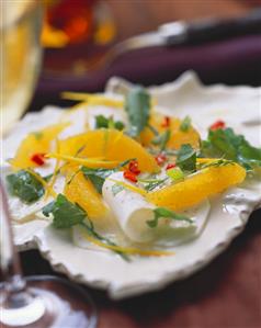 Kohlrabi carpaccio with oranges and kohlrabi leaves