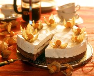 Peach cream gateau, decorated with cape gooseberries