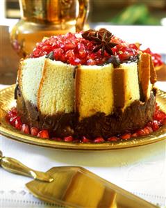 Madeira cake charlotte with chocolate and pomegranate seeds