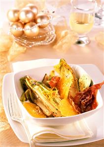 Chicory fried in herb butter with oranges and bacon