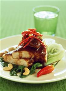 Chicken breast with tamarind sauce & cashew nuts on pak choi