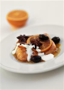 Salmon in orange butter with star anise and black olives