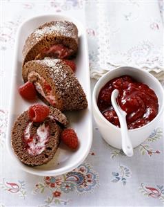 Chocolate sponge roulade with berry cream and berry jam