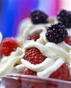 Fresh raspberries and blackberries with cream