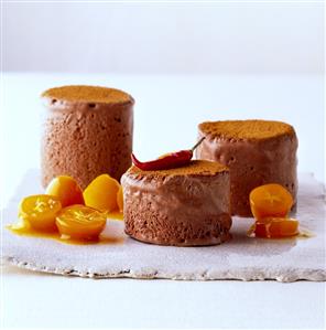 Chocolate parfait with chili and pieces of kumquat