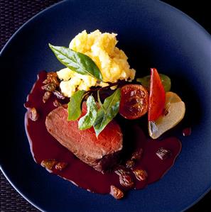 Braised pickled beef with chocolate sauce and raisins