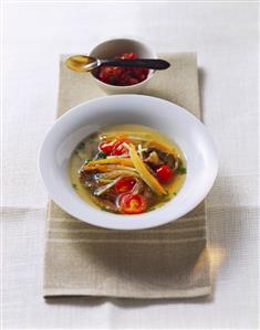 Vegetable soup with strips of beef and chutney