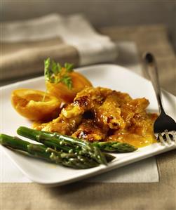 Chicken with apricot sauce and green asparagus