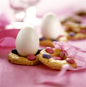 Pastry rings decorated with chocolate beans for Easter