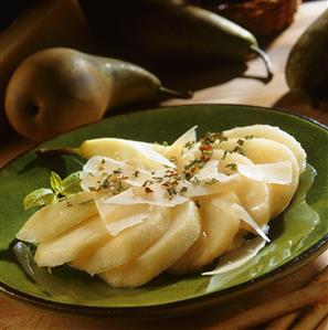 Poached pear with shavings of young Parmesan cheese