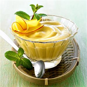 Asian mango cream in small glass bowl