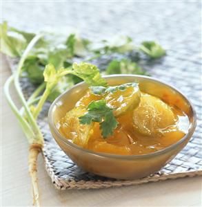 Mango chutney in small glass bowl