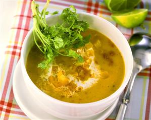 Creamed pepper soup with curry powder and coriander leaves