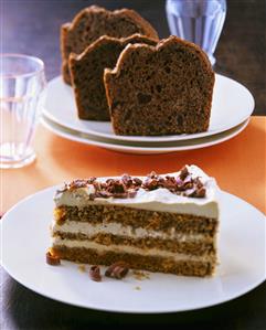 Piece of mocha cream cake, amaretti cake behind