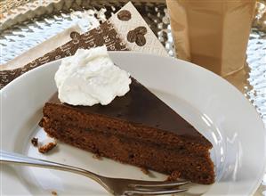 Piece of Sacher torte with cream