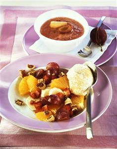 Fruit salad with cream and plum sauce