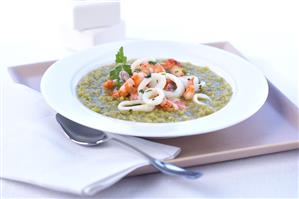 Pea soup with shrimp and squid rings