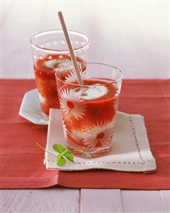 Two glasses of strawberry and melon smoothie