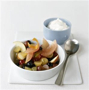 Fruit salad with green tea, low-fat yoghurt behind