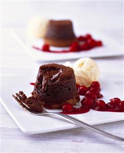 Chocolate soufflé with cherry compote and vanilla ice cream