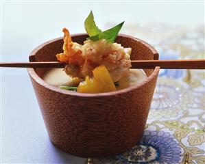 Spiny lobster in almond tempura over polenta soup