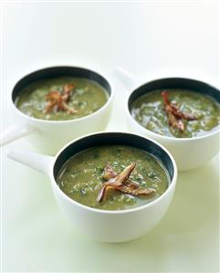 Three bowls of parsley soup and ham