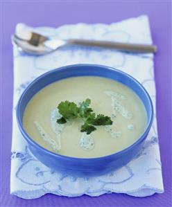 Avocado soup in a blue soup bowl