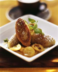 Ricotta dumplings with bananas and lemon syrup