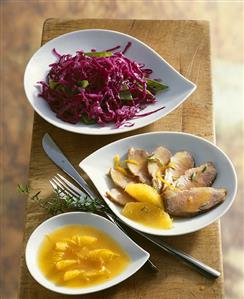 Duck breast with orange sauce and red cabbage salad