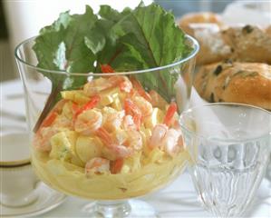 Egg salad with pineapple & shrimps, a few baguettes nearby