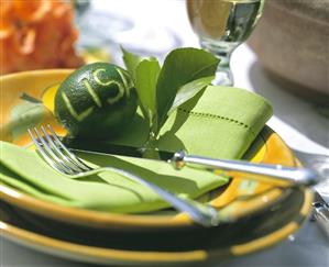 Table setting with lime place card & lime-green napkin