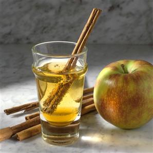 Cider drink with cinnamon sticks