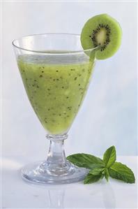 Kiwi drink with kiwi slice and mint leaves