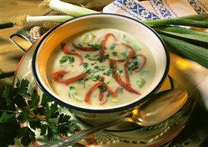 Leek soup with strips of ham and parsley