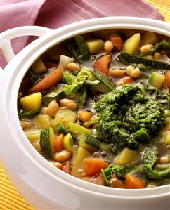 Vegetable soup with pesto in soup tureen