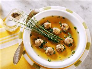 Game broth with liver dumplings and chives