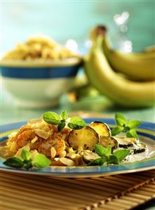 Curried rice with bananas, courgettes & flaked almonds