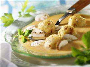 Cream of mushroom soup with bacon dumplings & parsley