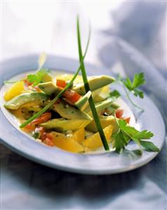 Avocado segment with tomato & orange dressing and capers