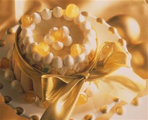 Charlotte with candied fruit and gold bow