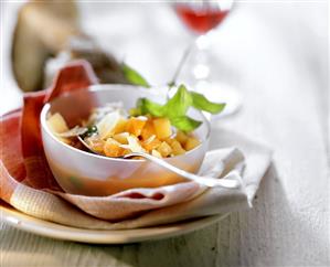 Light minestrone with carrots in white bowl (1)