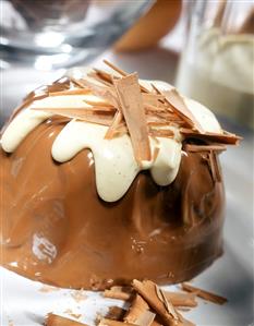 Chocolate blancmange with vanilla sauce & chocolate curls