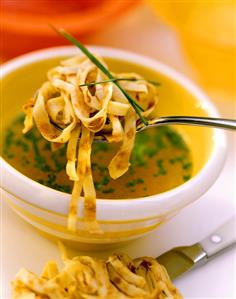 Pancake soup with chives on spoon & in bowl (1)