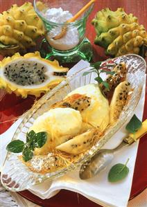 Lemon mousse with pitahaya and sugar strands on glass plate (2)