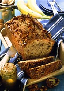 Banana cake, slices cut, with chopped walnuts