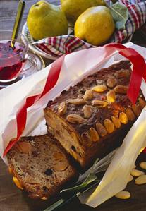 Quince jelly sweets decorated with almonds, in wrapping paper