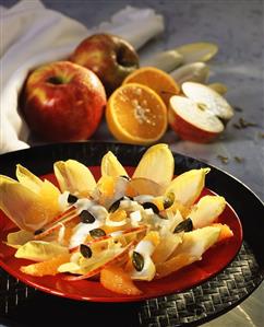 Chicory salad with apples, oranges and pumpkin seeds