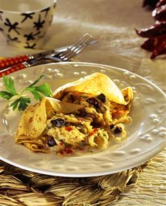 Galettes with spicy cabbage and sour cherries on plate